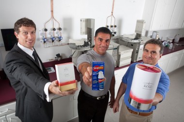 CAN DO Vice President of Sales and Marketing Joseph Lettiere, Wellness Formulations Vice President Anthony Cicini and Wellness Formulations President Thomas Cicini display some of the products created in Valmont Industrial Park by Troy Manufacturing and Wellness Formulations.